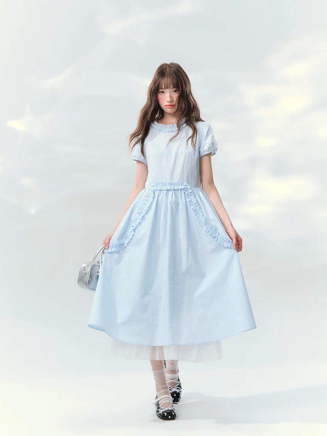 Blue ruffled dress with puff sleeves and waist detail