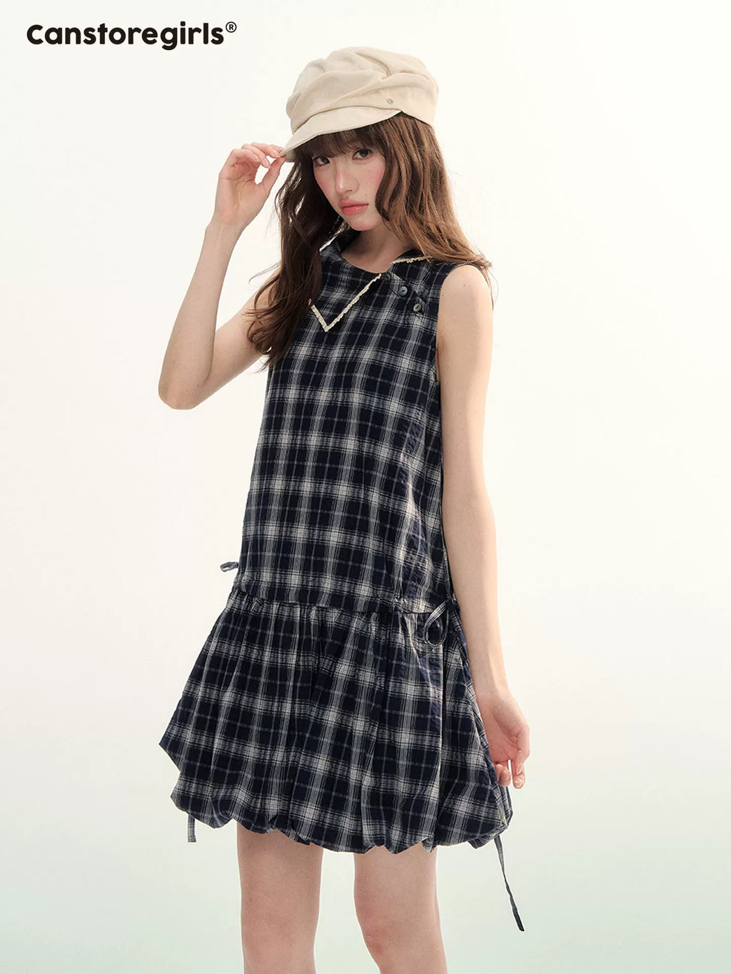 Sleeveless checked peplum dress with lace trim