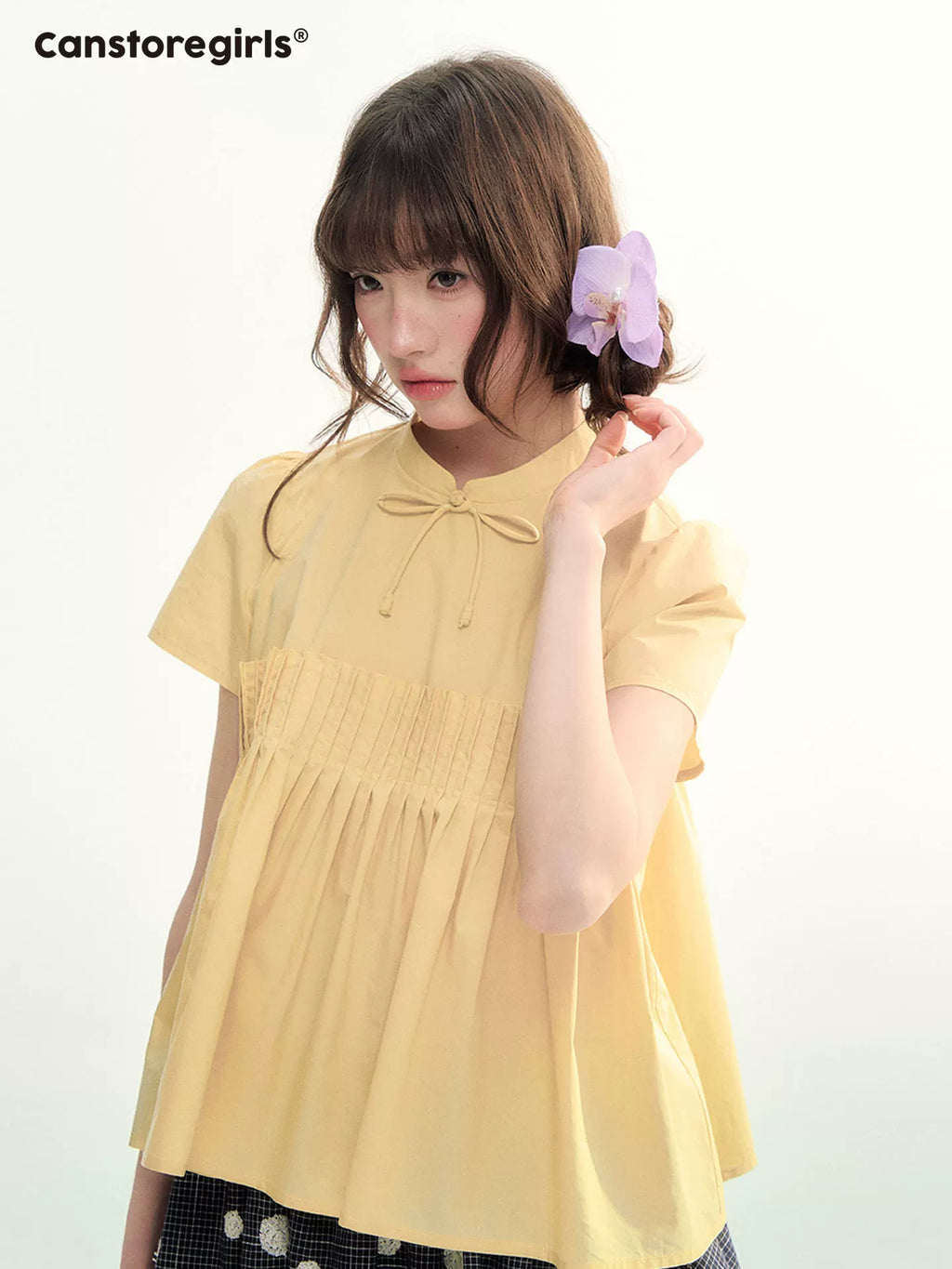 Yellow pleated short sleeve shirt