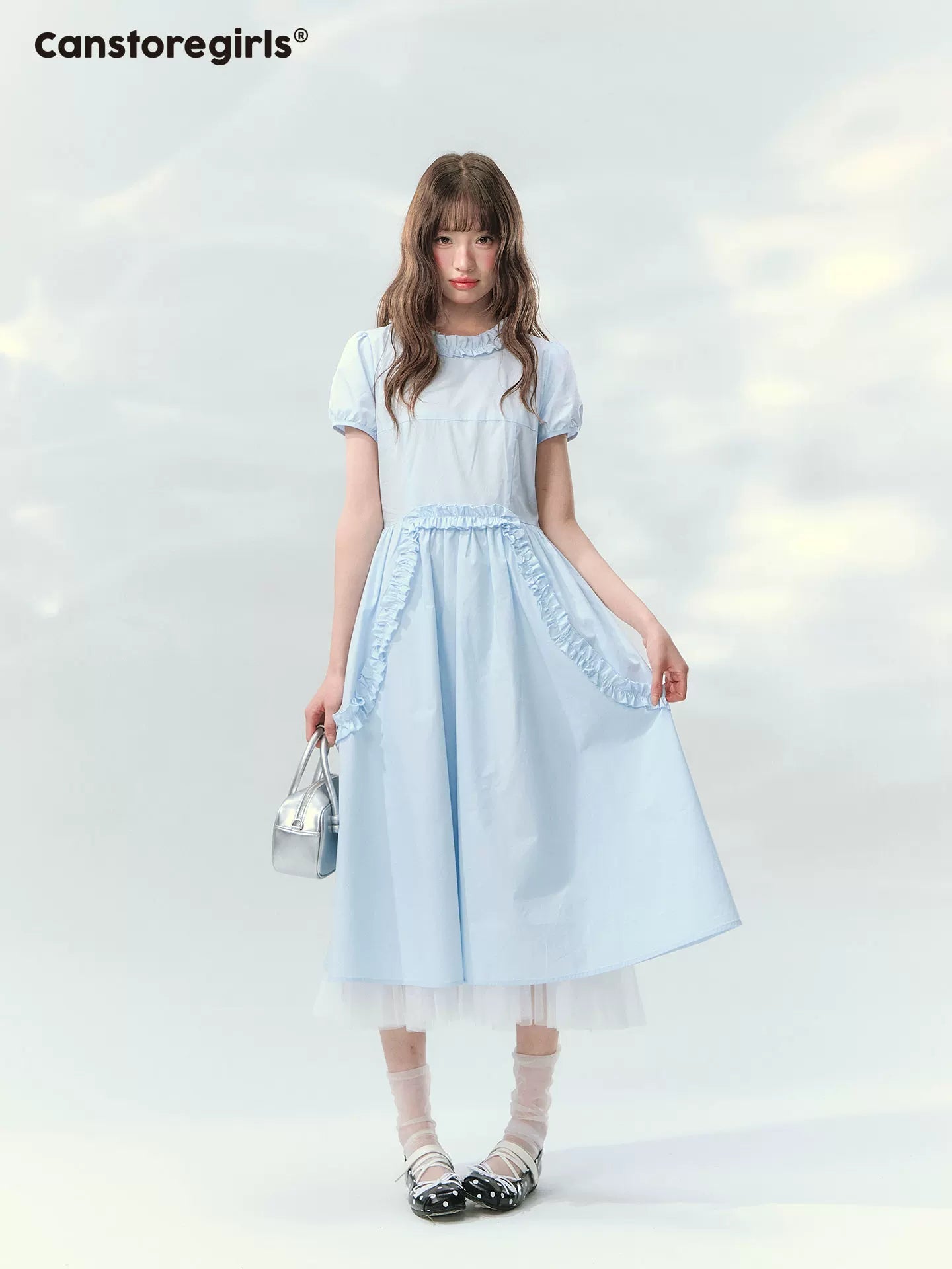 Blue ruffled dress with puff sleeves and waist detail