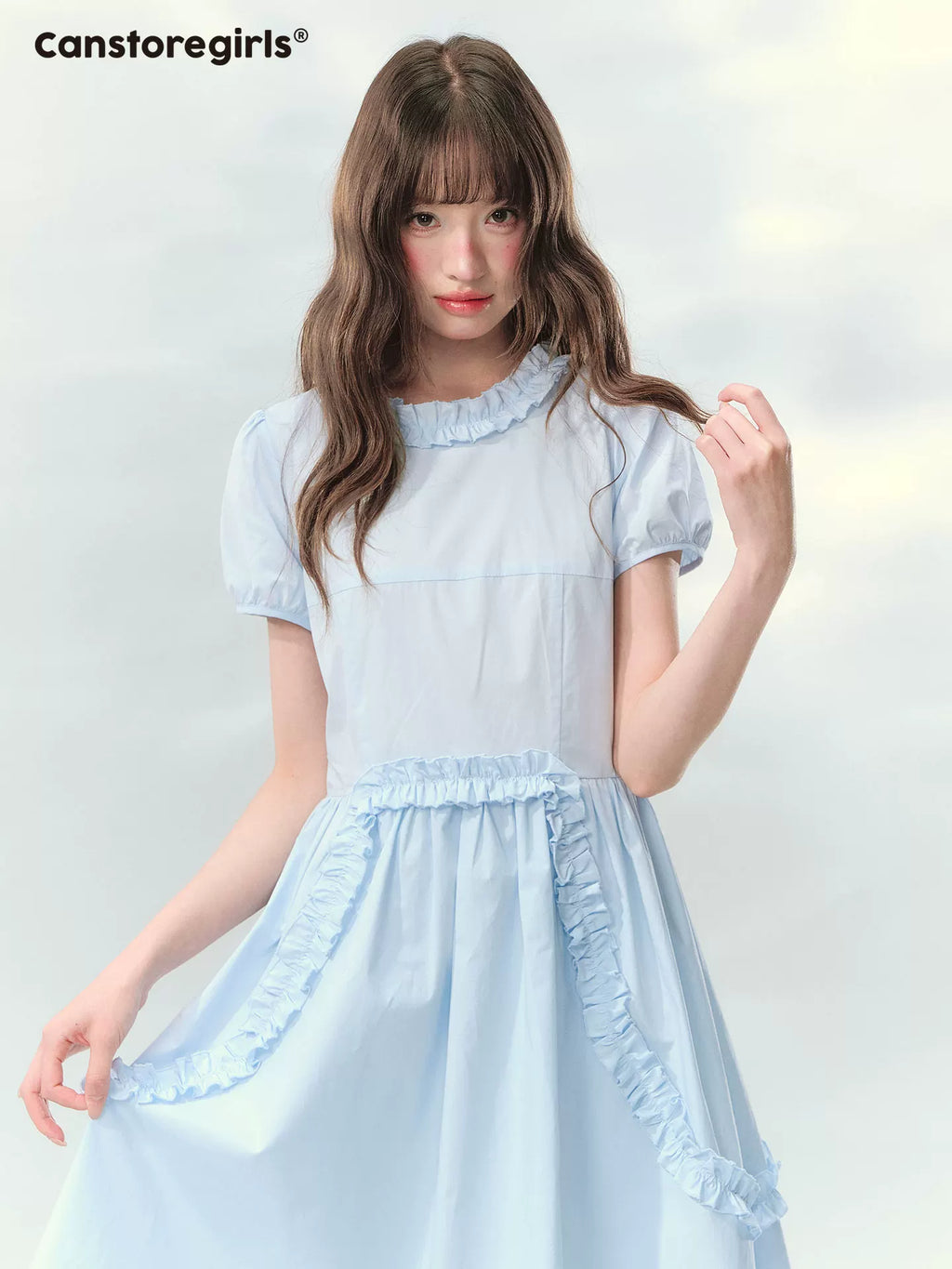 Blue ruffled dress with puff sleeves and waist detail