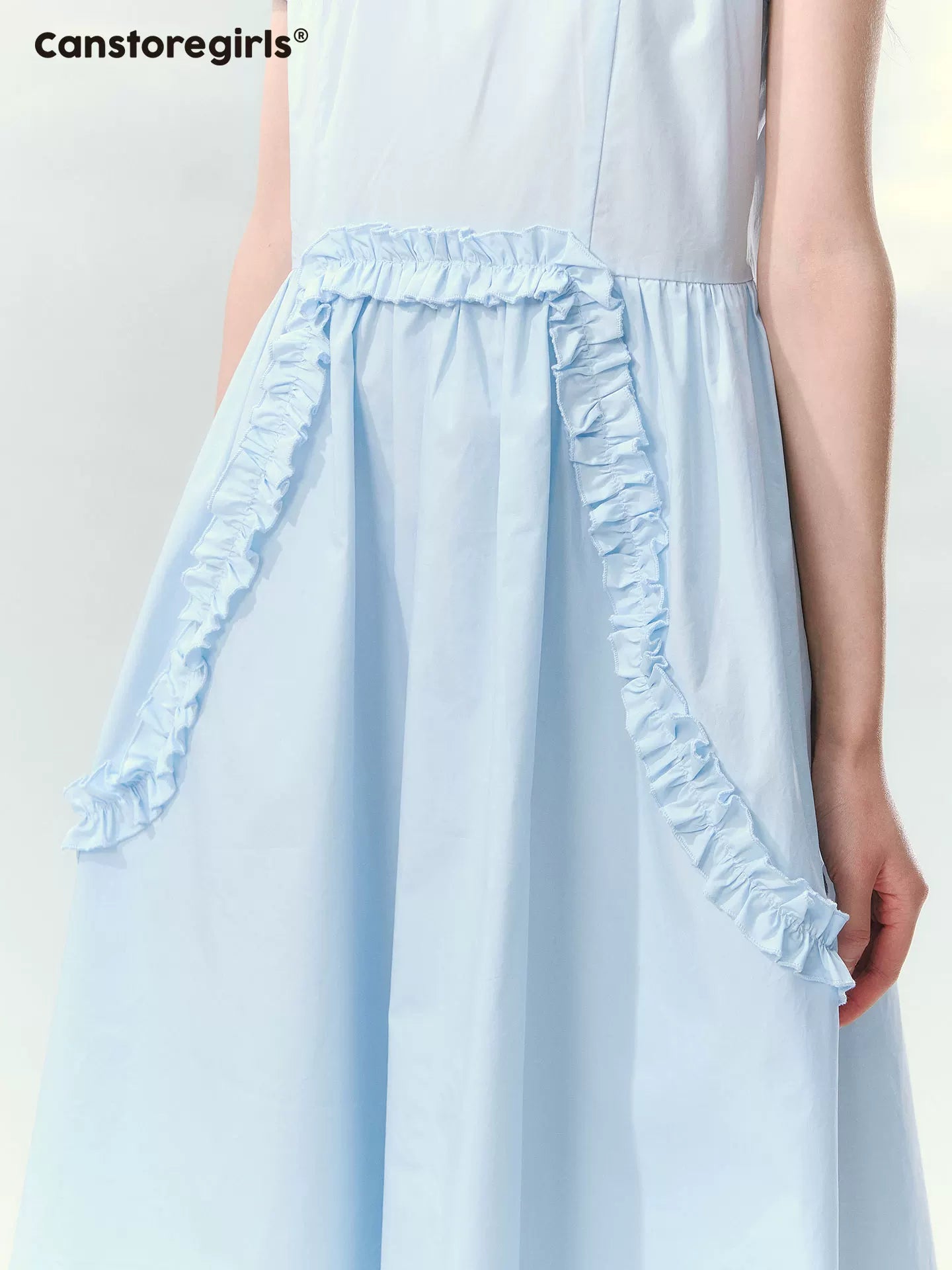 Blue ruffled dress with puff sleeves and waist detail